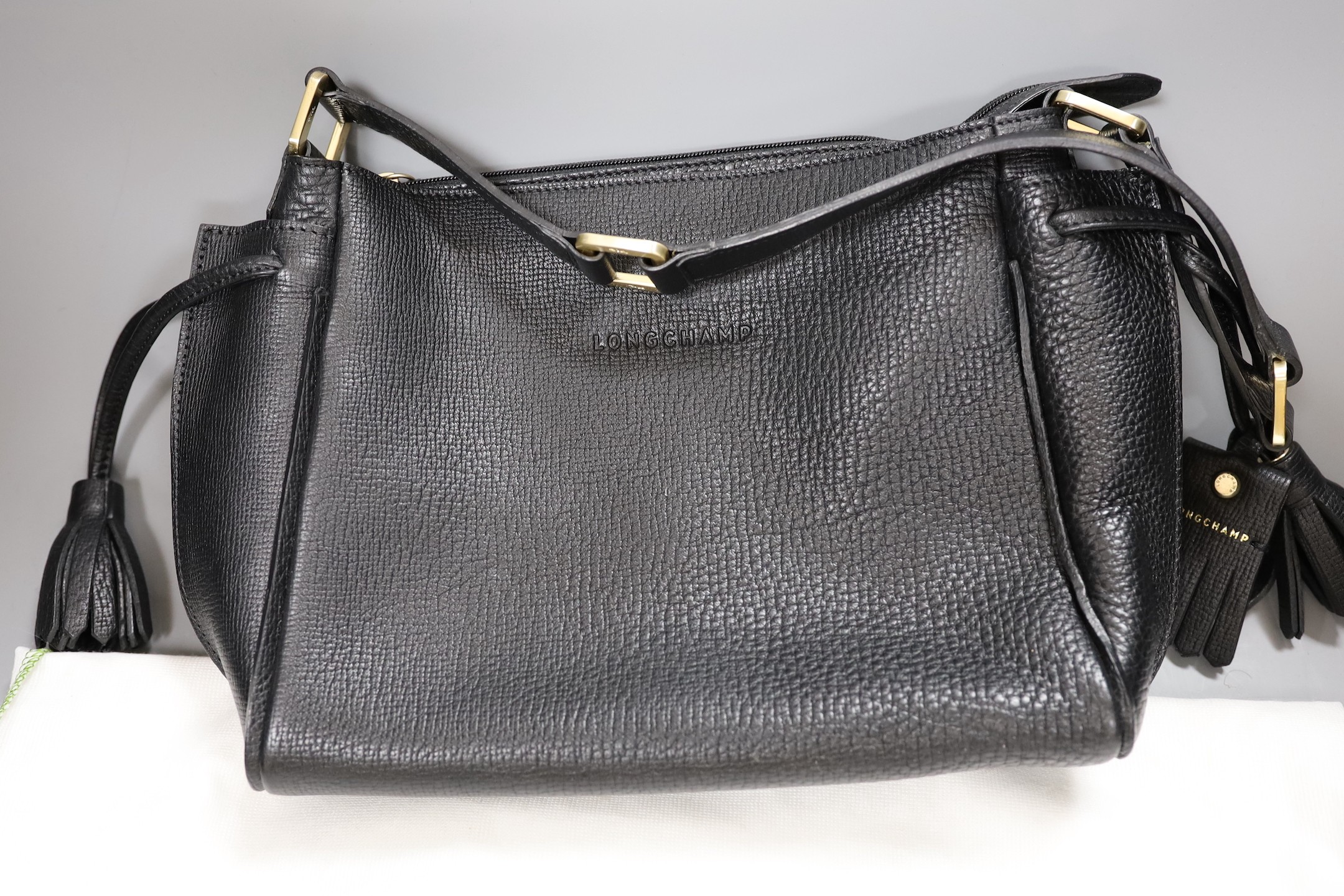 A black leather Longchamp shoulder bag with dust bag, 35 cms wide x 21 cms high